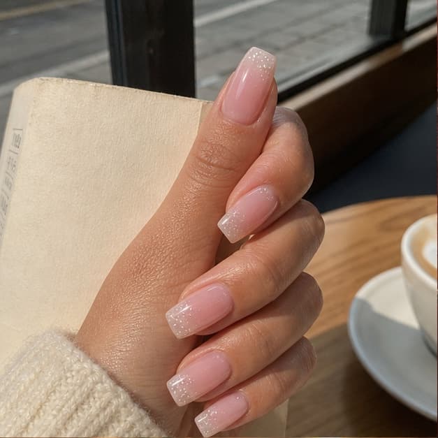 Nacre press-on nails in a warm everyday style diary scene