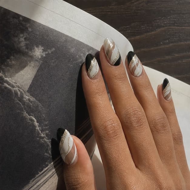 Minuit press-on nails in a warm everyday style diary scene